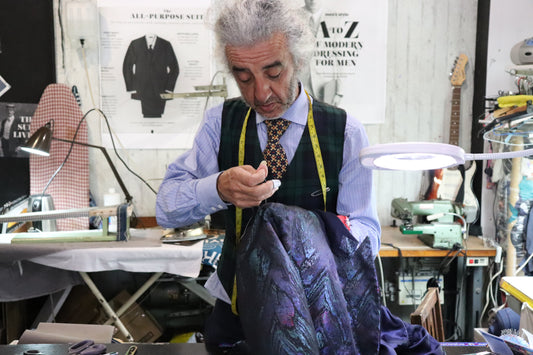 Hand sewing the internal structure of an Italian designer jacket by a bespoke tailor in Brisbane