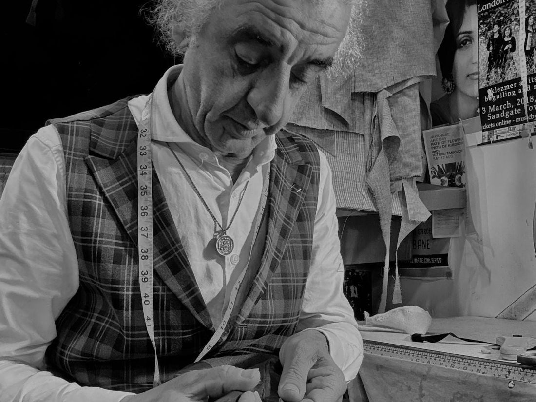 Close-up of a Master Tailor hand-sewing a jacket lining at West End Tailor in Brisbane.