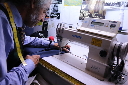 A close up of a sewing machine at West End Tailor in Brisbane, performing expert suit alterations.