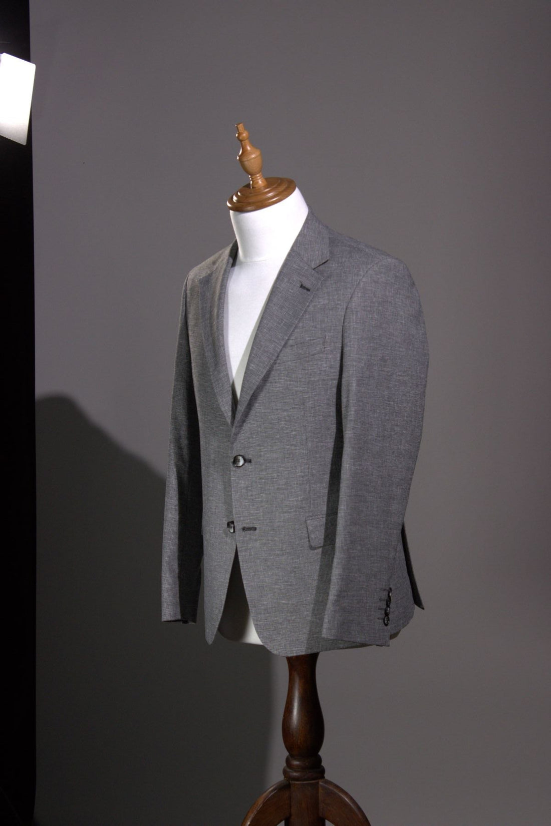Unstructured lightweight summer jacket in unlined tropical wool displayed on a dress form at West End Tailor in Brisbane.
